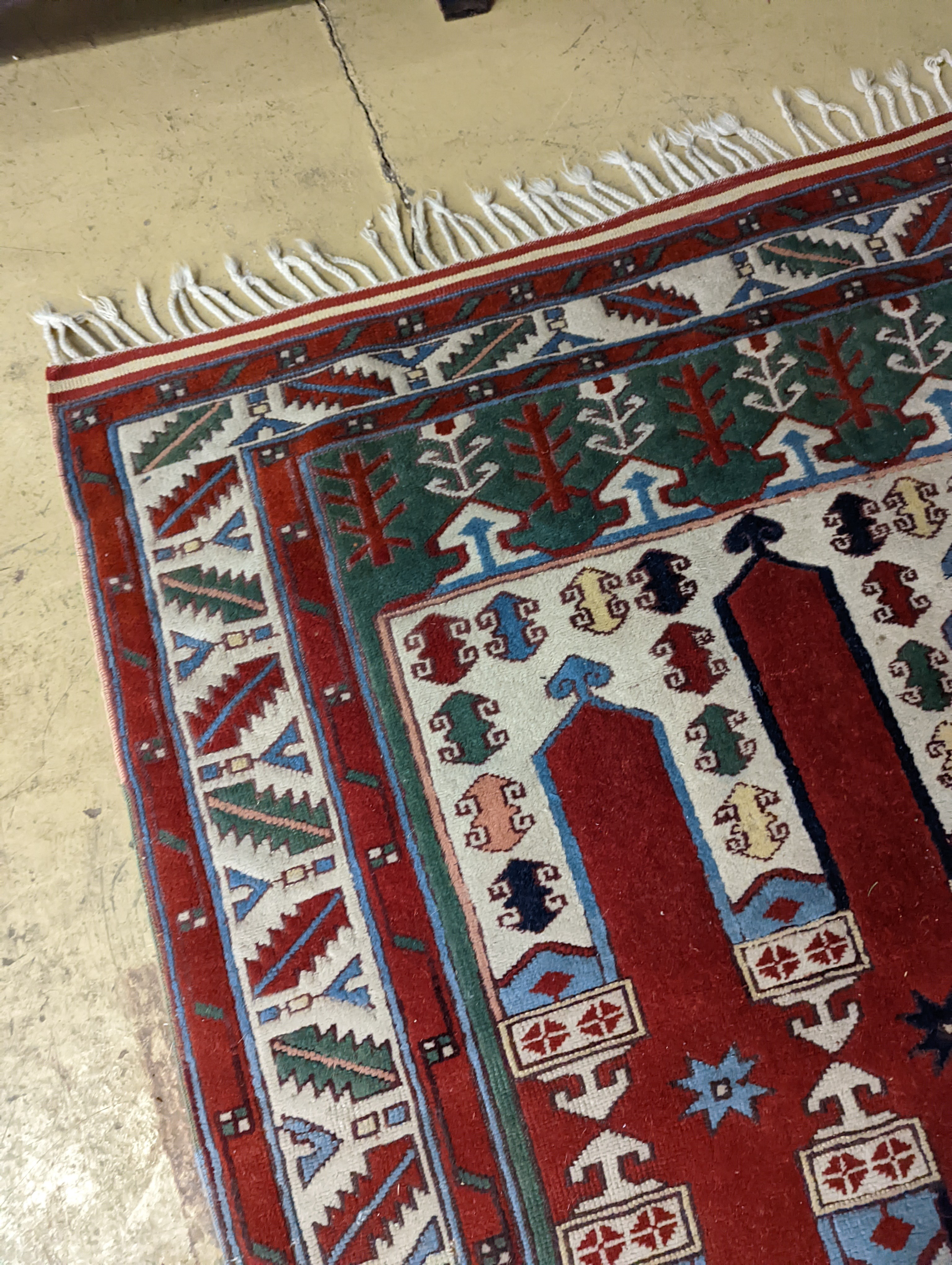 Two Turkish rugs and a Persian rugs. Largest, 284x172cm.